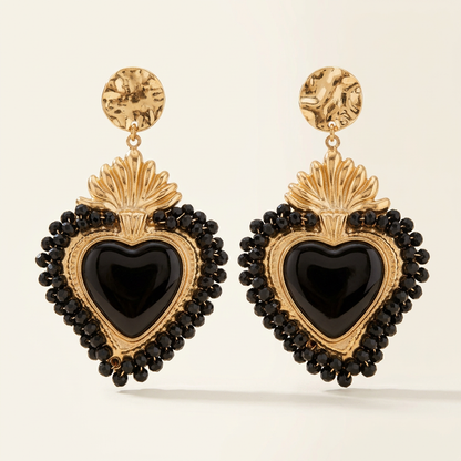 Fronte degli orecchini Cuore Regale con cuore nero su sfondo avorio